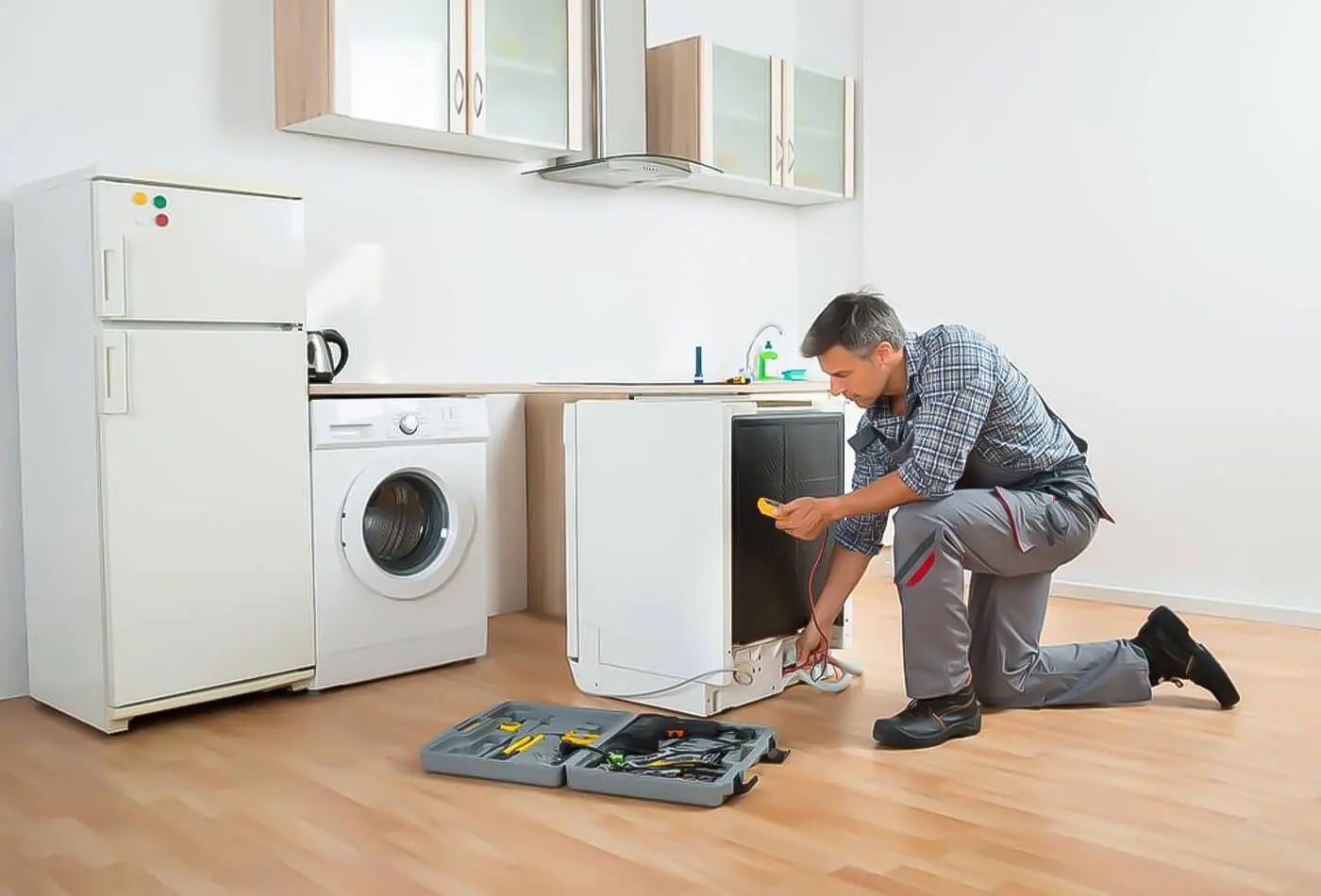 Technician repairing appliance at home